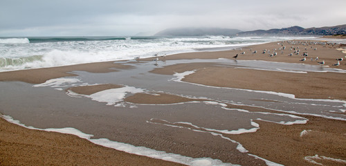 Wave sea water overflowing into Santa Clara river mouth estuary in Ventura California United States
