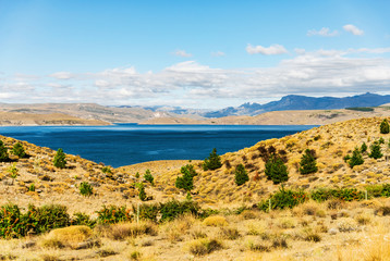 Beautiful landscape photo of turquoise aquamarine lake water and colorful yellow steppes in the...