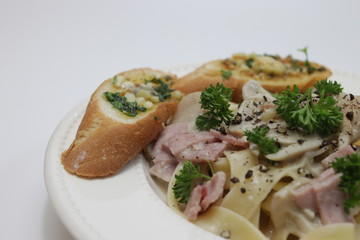 Italian Food, Fettuccine Alfredo, Italian Cream Sauce with Mushroom and Ham, topped with Parsley