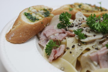 Italian Food, Fettuccine Alfredo, Italian Cream Sauce with Mushroom and Ham, topped with Parsley