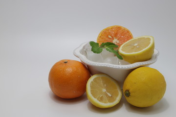 Orange , Lemon and Mint Leaves on White background Citrus Fruits full with Vitamin C, delicious and Refreshing, good for  health, valued as part of a nutritious and tasty diet