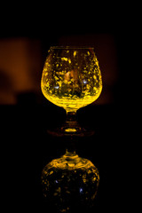 Glass of whiskey glow in the dark.