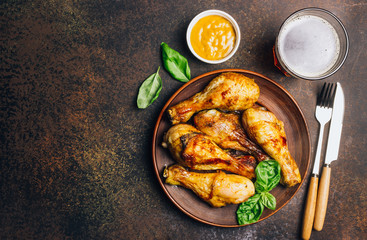 Roasted chicken legs cooked with sauce from mustard and olive oil