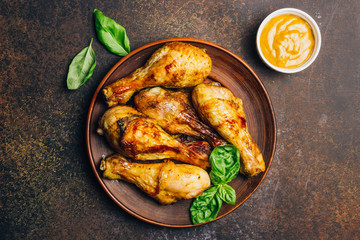 Roasted chicken legs cooked with sauce from mustard and olive oil