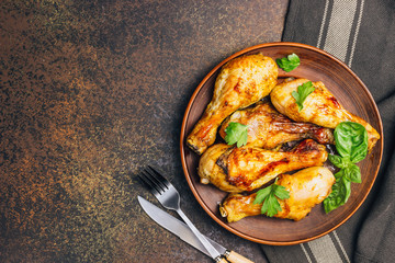 Roasted chicken legs cooked with sauce from mustard and olive oil