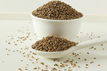 ajwain or Trachyspermum ammi,caraway herb spice seeds in bowl and spoon