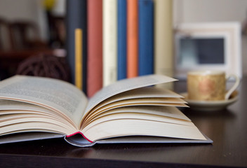 open book on wooden table detail with space to write