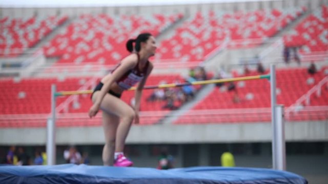 Track and field athletes competition, high jump