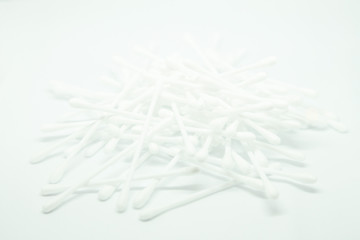 Cotton sticks buds heap isolated on white background