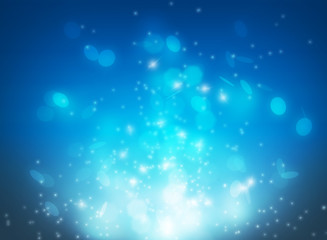 Blue magical burst effect and glitter light sparkle floating from bottom scene on dark background