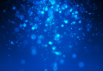 Obraz na płótnie Canvas Mini glitter light with blue bokeh falling from top set on dark background