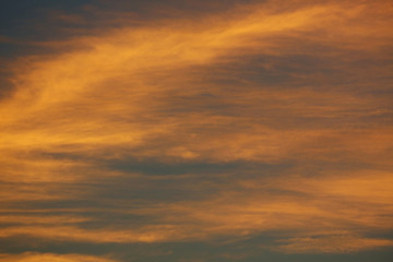 orange sunlight shiny through cloud on dramatic dusk sky