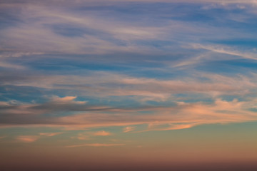 Naklejka premium Bright orange sky at sunset. Pink clouds in the sun at dawn.