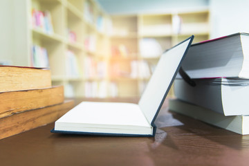 book opened on the table bookshelf background