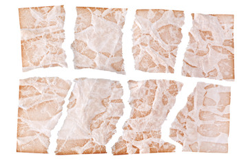 Torn sheets of brown aged paper on white background isolated close up, ragged shreds of old paper design, copy space,  damaged ancient document or letter layout, wrinkled damaged pattern page texture