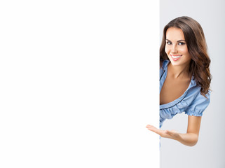 Young woman showing blank signboard