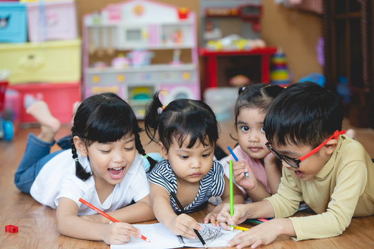 Kid Asian student doing homework .Kid enjoy learning with happiness at home. Education concept.