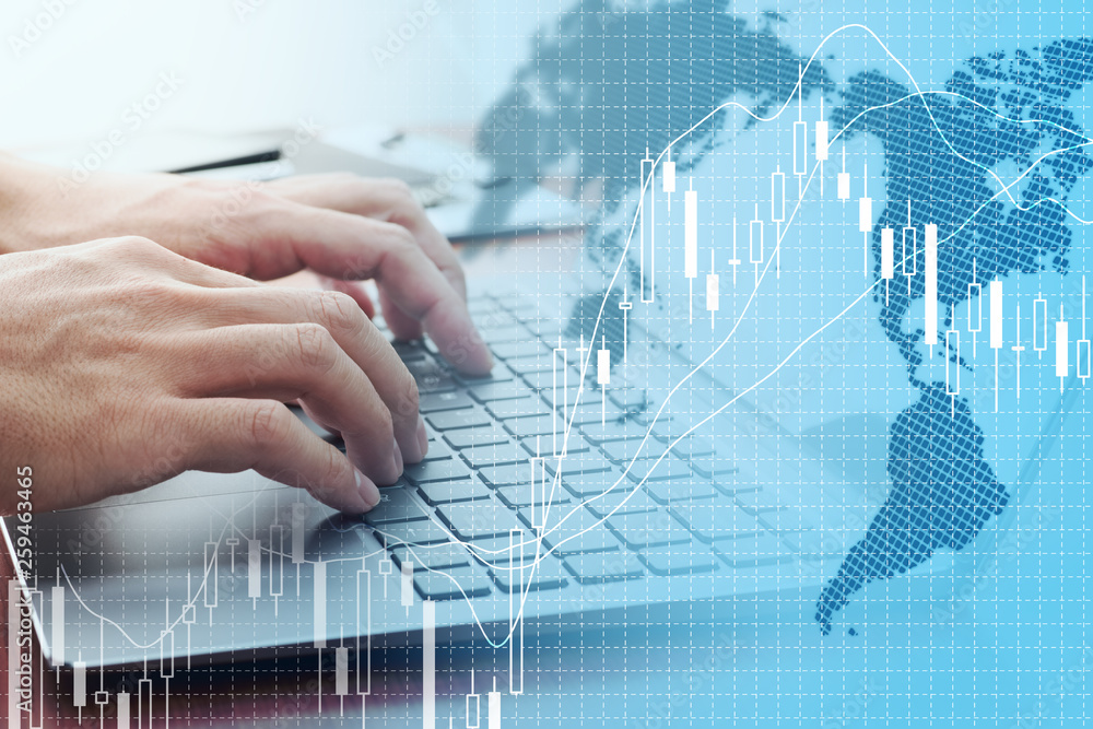 Poster global stock market concept. using laptop for stock exchange.world map, candlestick chart and laptop