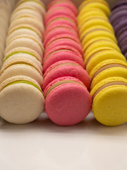 Many beautiful colored macarons in the box