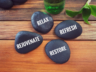 Plakat Motivational and inspirational words - Relax, Refresh, Rejuvenate, Restore written on pebbles.