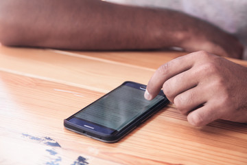 Male hand using a smartphone. Business, Technology