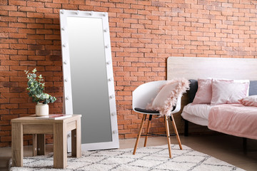 Interior of bedroom with big mirror