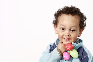 Fototapeta na wymiar little boy with sweet chocolate Easter eggs on white background