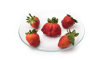 Strawberry in a bowl on a white background