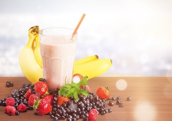 Healthy Fruit Smoothie in glass on wooden table Background