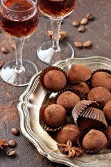  Sweet chocolate candy with liqueur in glass, dessert table