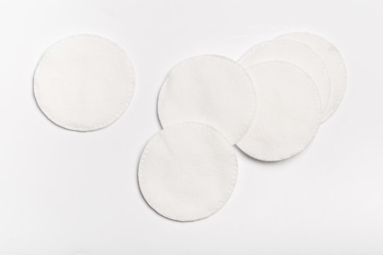 Cotton pads isolated on white background. Top view