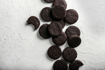 Fototapeta premium Tasty chocolate cookies on white textured background