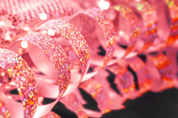 Shiny streamer on dark background, closeup