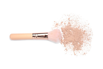 Facial powder and brush on white background