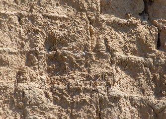 Old clay bricks wall as background