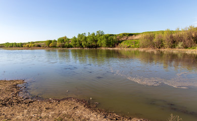 Pond in spring steppe as background