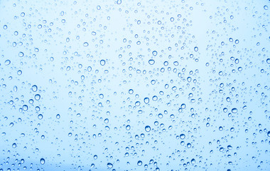 Naklejka na ściany i meble Water drops on glass, rain drop