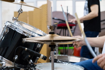 Fototapeta na wymiar Drummer playing his kit. Drums close up