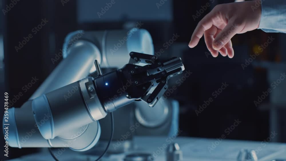 Aufkleber futuristic robot arm touches human hand in humanity and artificial intelligence unifying gesture. co