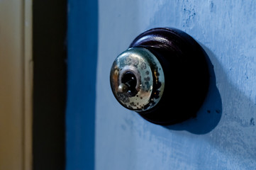 Brass vintage safety electricity flip switch on a wall