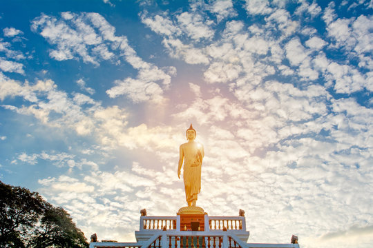 Standing Buddha image And the blue sky, religious concepts