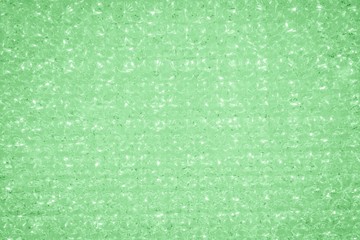 Trendy crystal glitter texture in mint color. Glittery shiny lights background