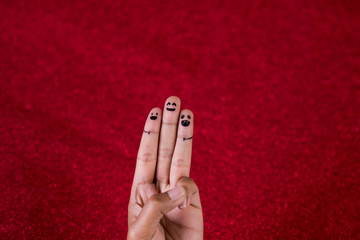 Red background and fingers and cute smile Art concept