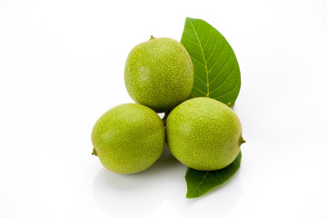 Young green walnuts with leaves