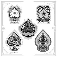 Set of ace of spades with flower pattern, heraldic ellements and octopus. Prints isolated on white