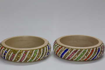 Close up of pair of bangles isolated on white background with space for text