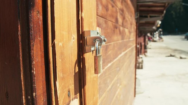 Empty closed shops. Lock on window. Shot on RED Raven camera