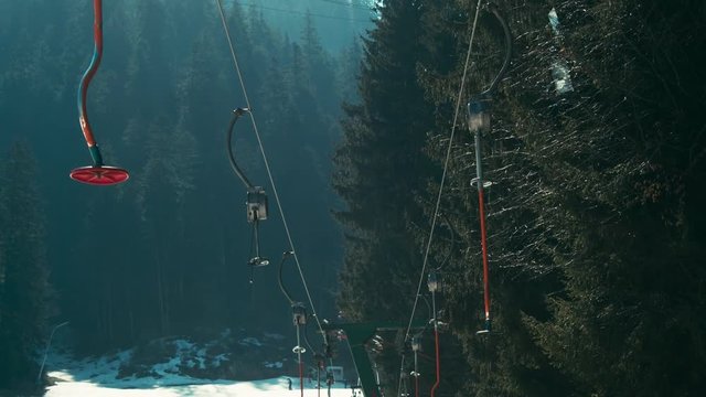 Empty ski lift in the spring. Shot on RED Raven.