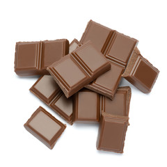 Milk organic chocolate pieces isolated on white background