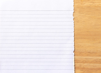 Obraz premium Notebook Lined Paper on wood Background